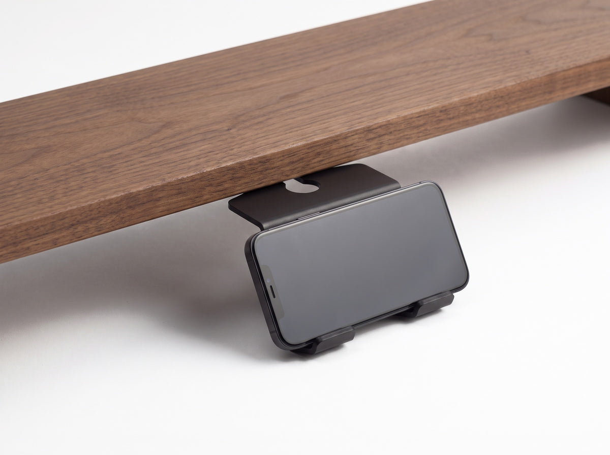 Phone Stand for Monitor Riser in Black – styled studio packshot | Rablo