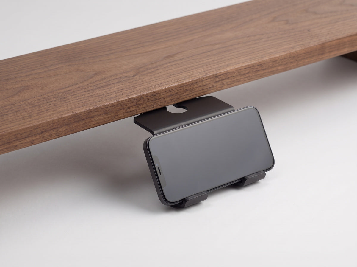Phone Stand for Monitor Riser in Black – styled studio packshot | Rablo