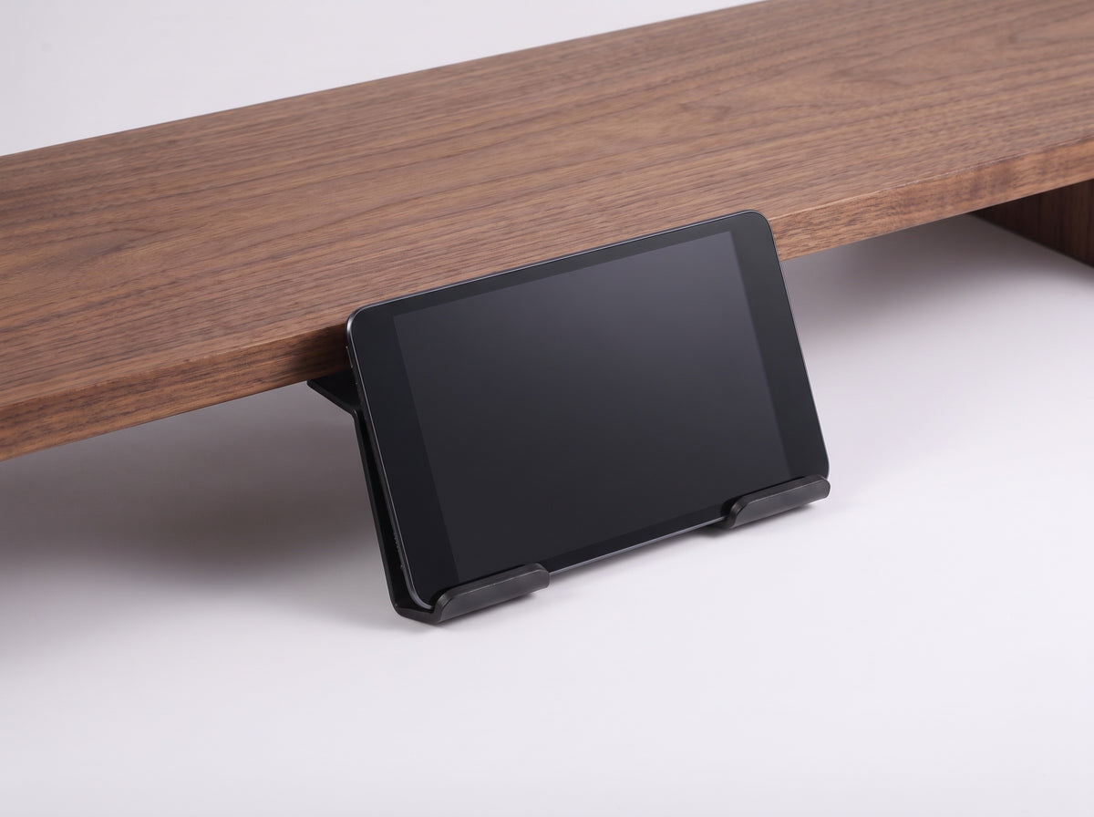 Tablet Stand for Monitor Riser in Black – styled studio packshot | Rablo